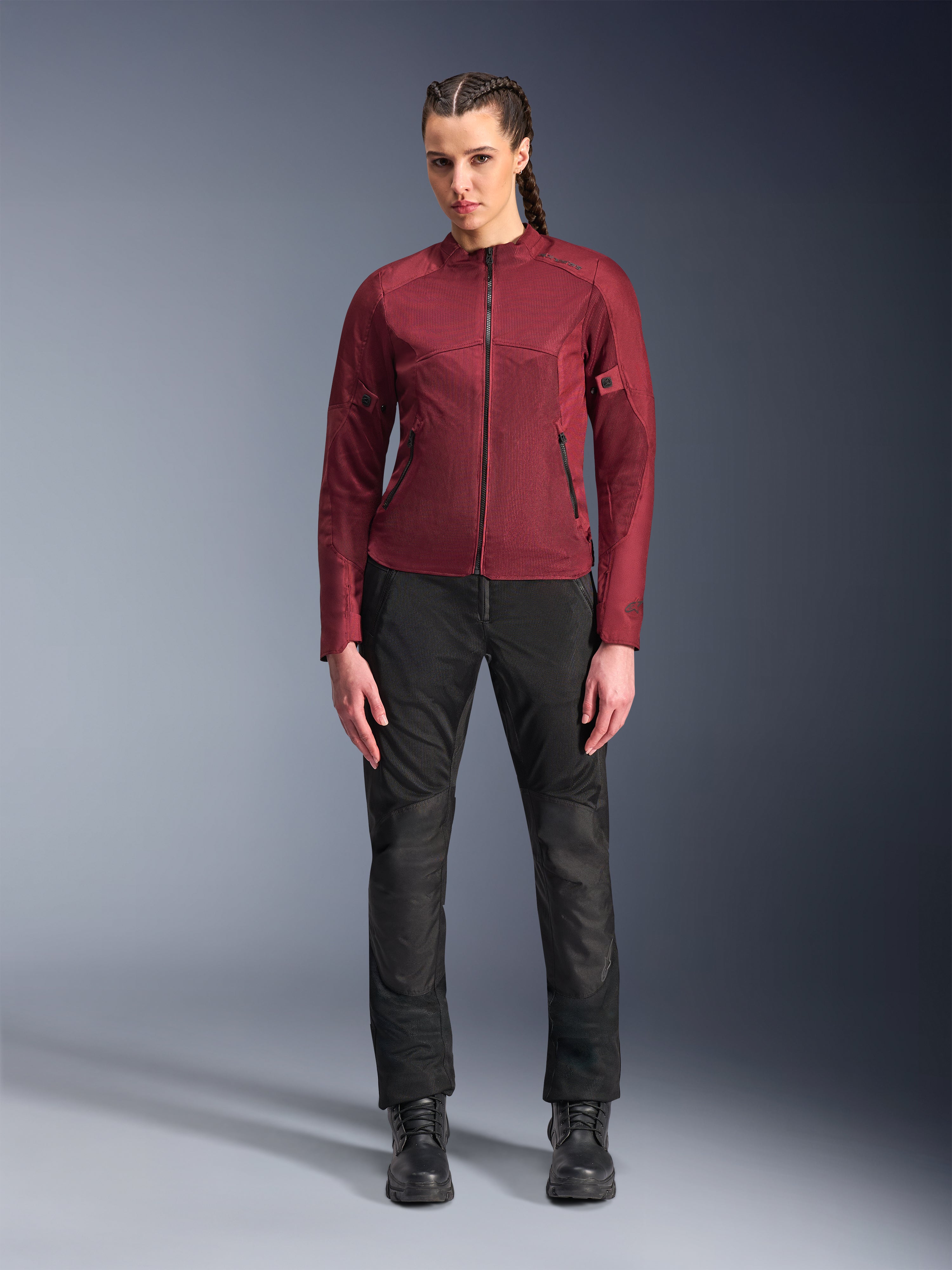 Alpinestars Stella C-1 Air Pants, Women's Urban Motorcycle Pants, Black, featuring textile and mesh construction, paired with a burgundy Stella C-1 Air Jacket and black leather boots, clean and modern urban riding style