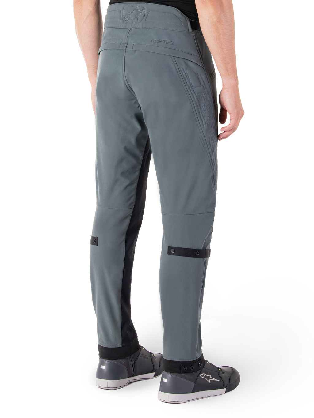 Alpinestars Alden Pants, Urban Gray, rear side view, streetwear-inspired technical riding pants with quilted detailing on the waist and black calf straps, paired with gray riding shoes, modern urban motorcycle gear