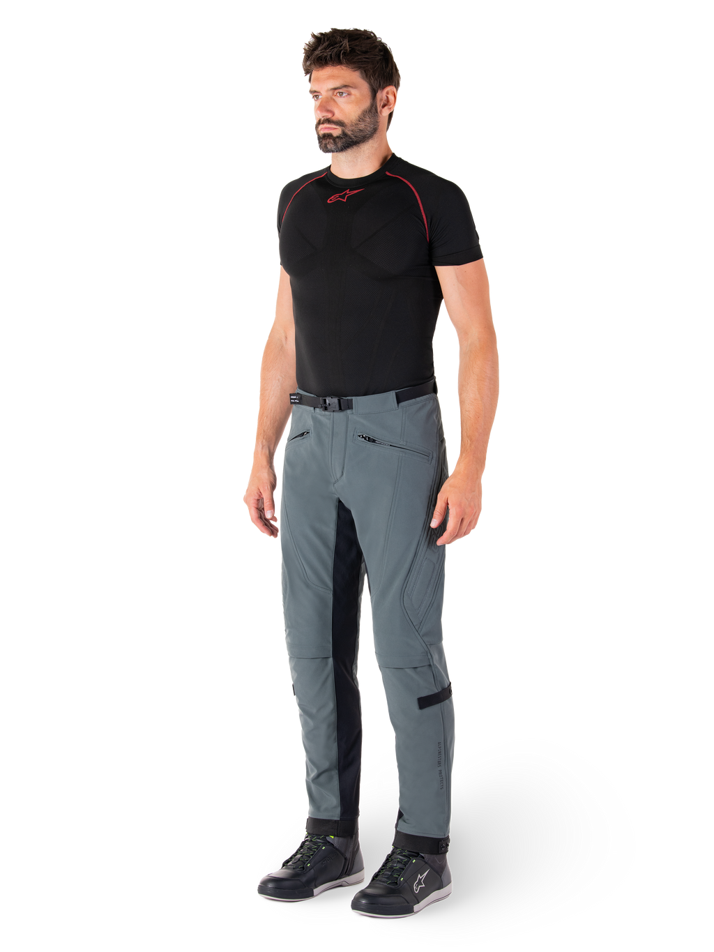 Alpinestars Alden Pants, Urban Gray technical motorcycle pants, featuring quilted side panels and black inner leg stretch fabric, styled with a black base layer and riding shoes, streetwear-inspired urban riding gear