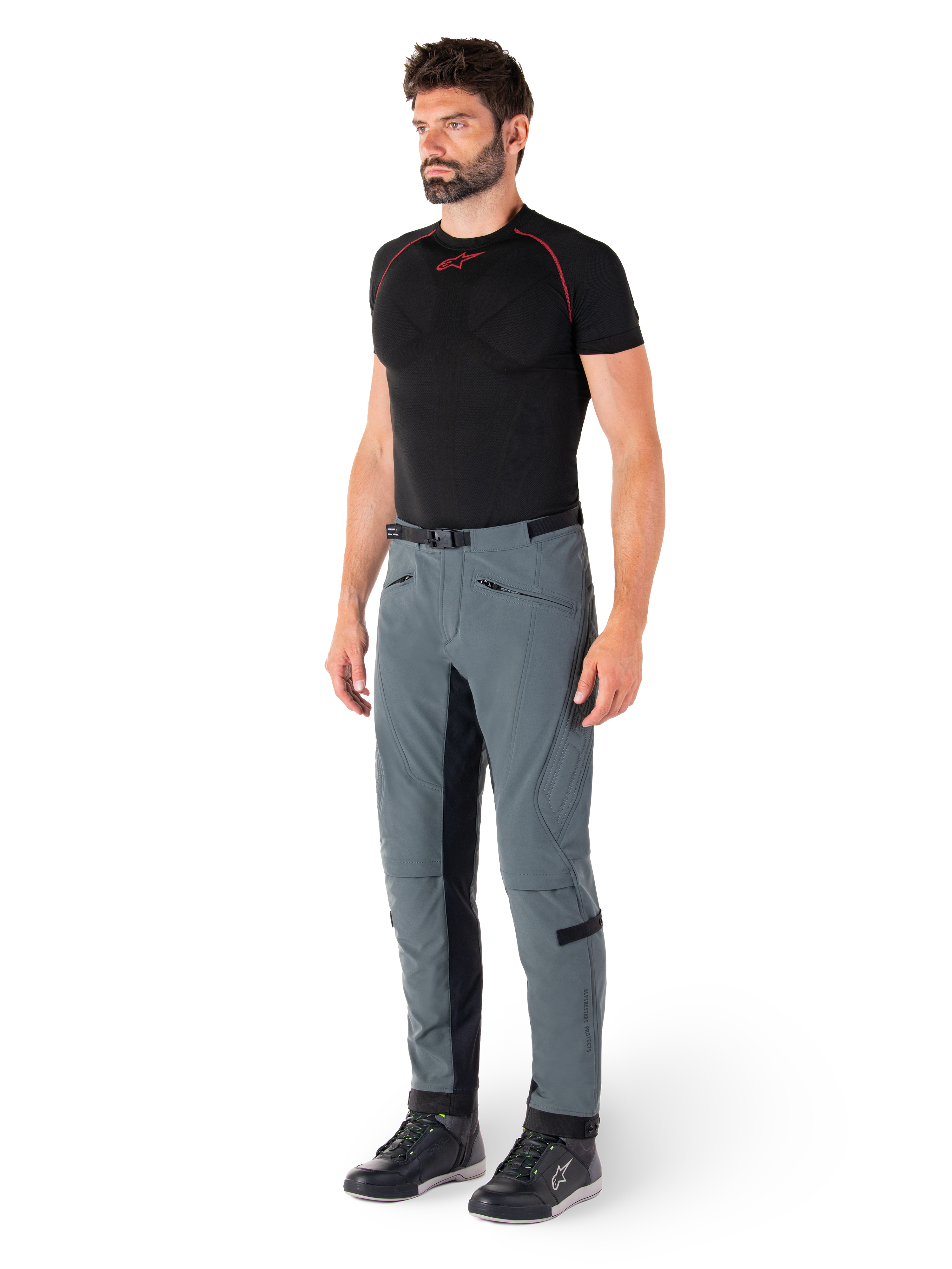 Alpinestars Alden Pants, Urban Gray technical motorcycle pants, featuring quilted side panels and black inner leg stretch fabric, styled with a black base layer and riding shoes, streetwear-inspired urban riding gear