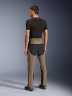 Alpinestars Flex-AST Explorer Pants, Adventure Motorcycle Pants, Walnut Black, rear view on model showing black ripstop seat and leg panels, stretch textile construction, and long lower-leg zippers for adventure touring