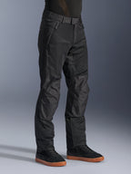 Alpinestars C-1 Air Pants, Urban Motorcycle Pants, Black, featuring breathable tech mesh panels and polyfabric construction, worn with black sneakers, clean and functional design for city riding.
