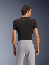 Alpinestars Aeroshell Airflow Pants, Mid Gray, back view, worn with a black short-sleeve base layer with red stitching and logo, featuring lightweight stretch softshell textile and mesh paneling for maximum ventilation, ergonomic sport fit for motorcycle riding