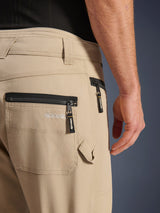 Alpinestars Flex-AST Canvas Pants, Brown, close-up of back and side pockets, featuring black zippers with branded pull tabs, embroidered logo, hammer loop detail, and heritage workwear styling in durable canvas.