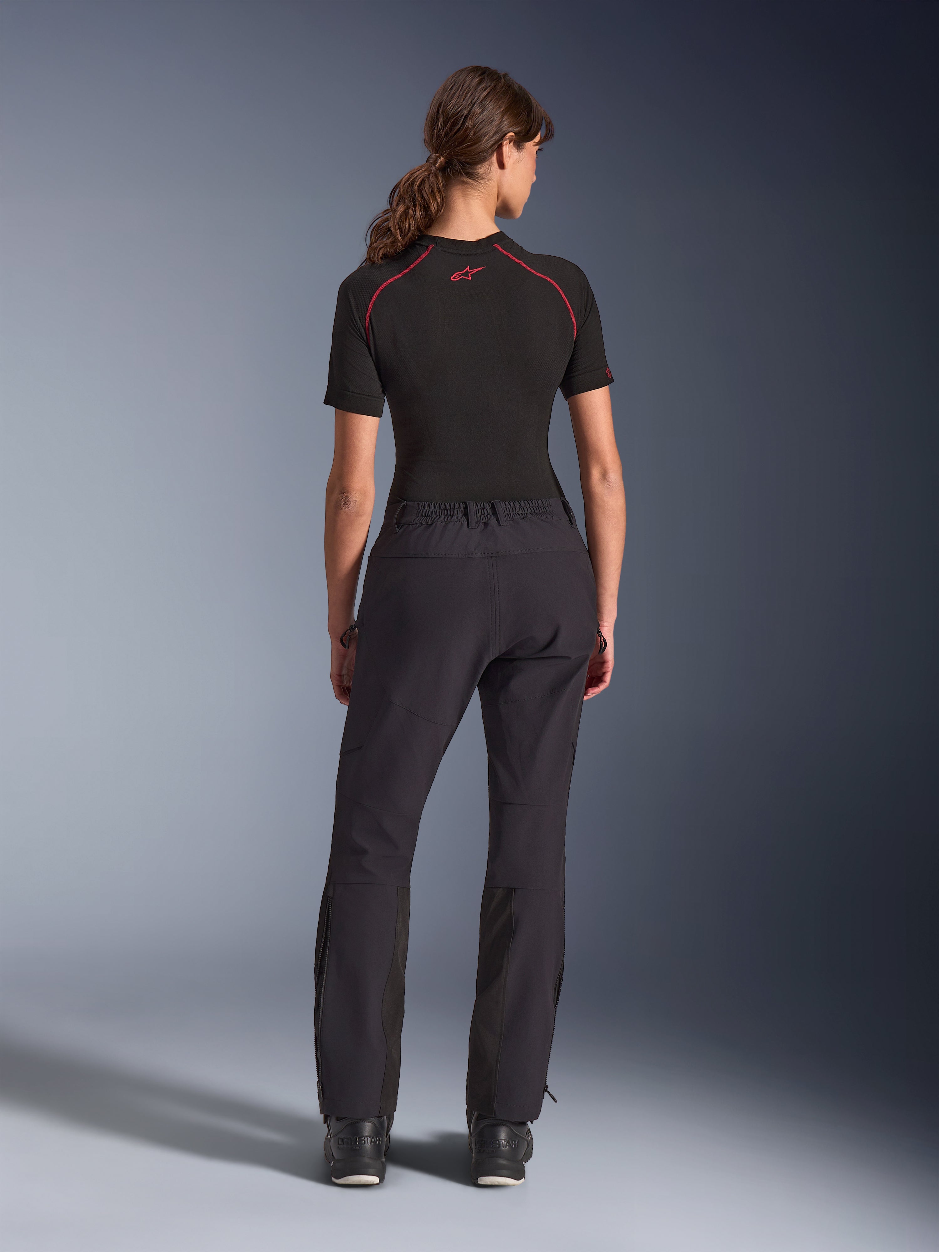 Alpinestars Woman Stella Flex-AST Explorer Pants, Black, rear view, adventure riding pants featuring stretch textile construction with ripstop reinforcements on the seat and knees, zippered lower legs, and a fitted feminine design.