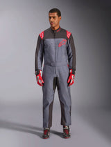 Alpinestars KMX-9 V3 Graphic 6 Suit, Karting Suit, Anthracite Black and Red, gray speckled graphic pattern, black panels on inner arms and legs, red Alpinestars logos on shoulders and chest, worn with red racing gloves and black shoes