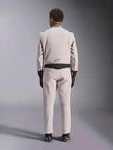 Alpinestars GP Race V3 Suit FIA, Silver Anthracite, back view of one-piece auto racing suit worn with black gloves and boots, featuring black stretch panels on the waist and sleeves, professional motorsport design