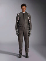 Alpinestars GP Race V3 Suit FIA, Auto Racing Suit, Black and Silver, front view of driver wearing complete racing gear including gloves and boots, professional motorsport design with Alpinestars branding on shoulders and belt