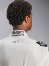 Alpinestars Hypertech V3 Suit, White, detail view of back collar and shoulder, featuring FIA 8856-2018 certification label, printed grey Alpinestars logo, and black extraction handle, professional racing gear