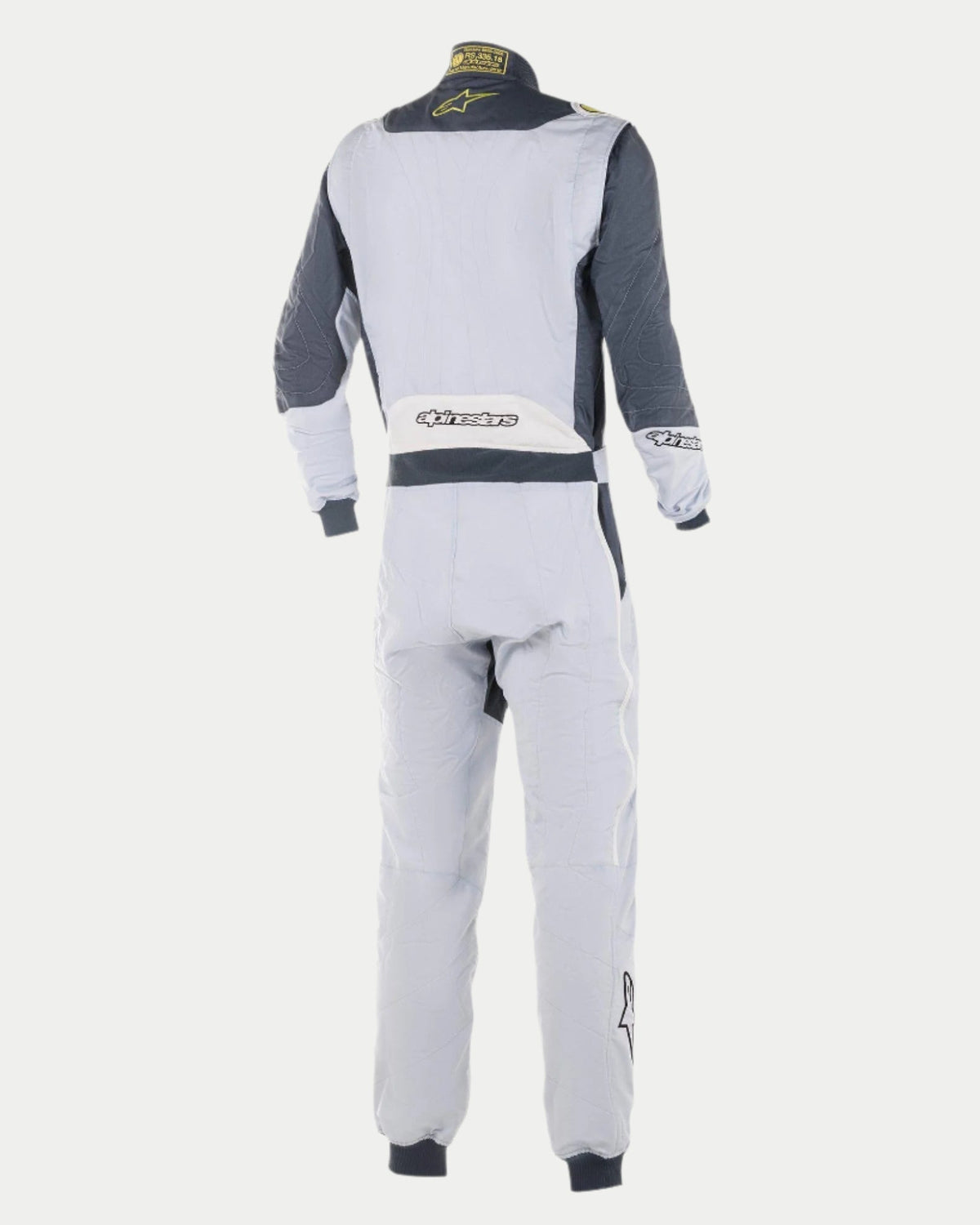 Alpinestars GP Pro Comp Suit, Professional Auto Racing Suit, Silver and Asphalt Gray, rear view showing light gray main body with dark gray shoulder panels, white lower back panel with Alpinestars logo, and lime yellow accents on the collar