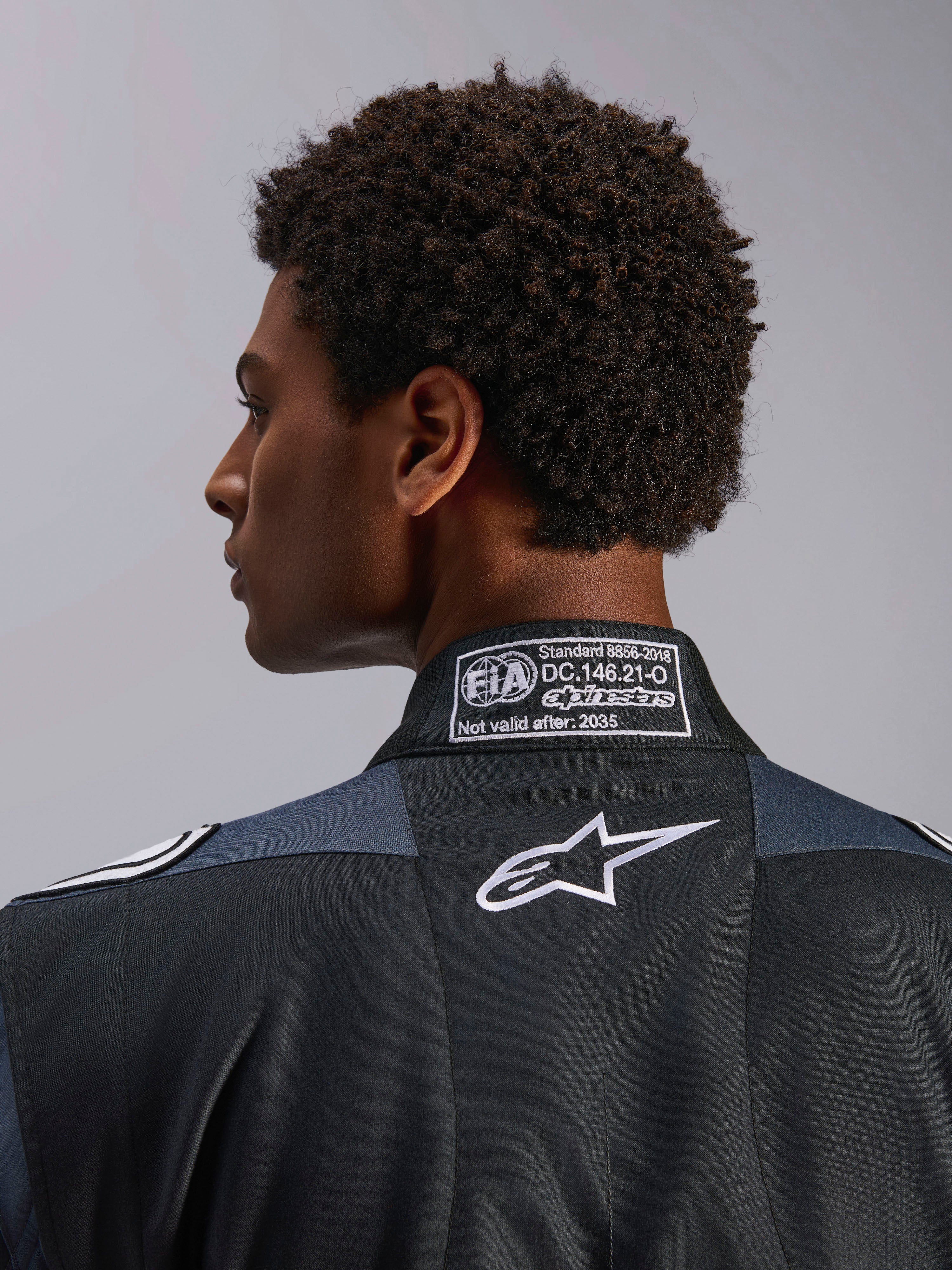 Alpinestars GP Pro Comp V2 FIA Auto Racing Suit, Black and Asphalt, with FIA 8856-2018 certification and white Astar logo.