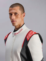 Alpinestars GP Tech V4 Suit, Auto Racing Suit, White Black and Red, worn by model, featuring red shoulder panels with Alpinestars logo, white torso with black side panels, and branded collar, professional motorsport gear