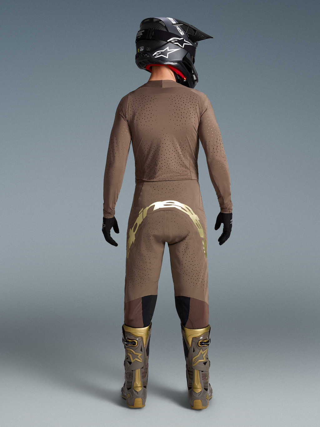 Alpinestars Limited Edition Supertech Air Gold motocross gear, men's brown and gold ventilated jersey, pants, and boots.