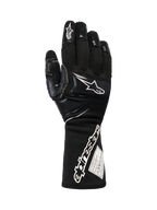 Alpinestars Tech-M V2 Gloves FIA, Black and White Pit-Crew Racing Gloves, featuring an extended cuff with bold Alpinestars branding and FIA certification tag, reinforced knuckle and finger patches for impact protection, professional motorsport gear