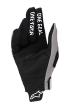Alpinestars 2025 Radar Pro Gloves, Motocross Gloves, Black with Grey accents, palm view featuring 'ONE GOAL ONE VISION' printed on the fingers, synthetic suede material, minimalist design for off-road performance