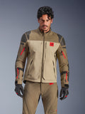 Alpinestars Nazca 3L GORE-TEX PRO Jacket, adventure motorcycle touring jacket, Walnut Rock Brown and beige with red accents, featuring black Superfabric shoulder reinforcements and red sleeve zippers, worn by rider with matching gear, premium technical adventure outerwear