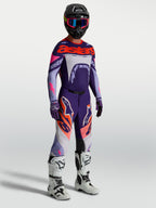 Alpinestars Supertech Dyna Pants in Purple and Pink Fluo, men's motocross gear with a matching jersey and white racing boots.