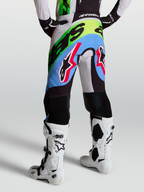 Alpinestars Supertech Dyna Pants, Motocross Racing Pants for Men, Light Lilac, Green, and Black with perforations and goat leather knees.