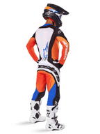 Motocross rider viewed from behind wearing the Alpinestars 2025 Techstar Melt Gear Set, Orange and Blue jersey with white back panel and matching pants, featuring large white branding, black motocross helmet, and white racing boots.