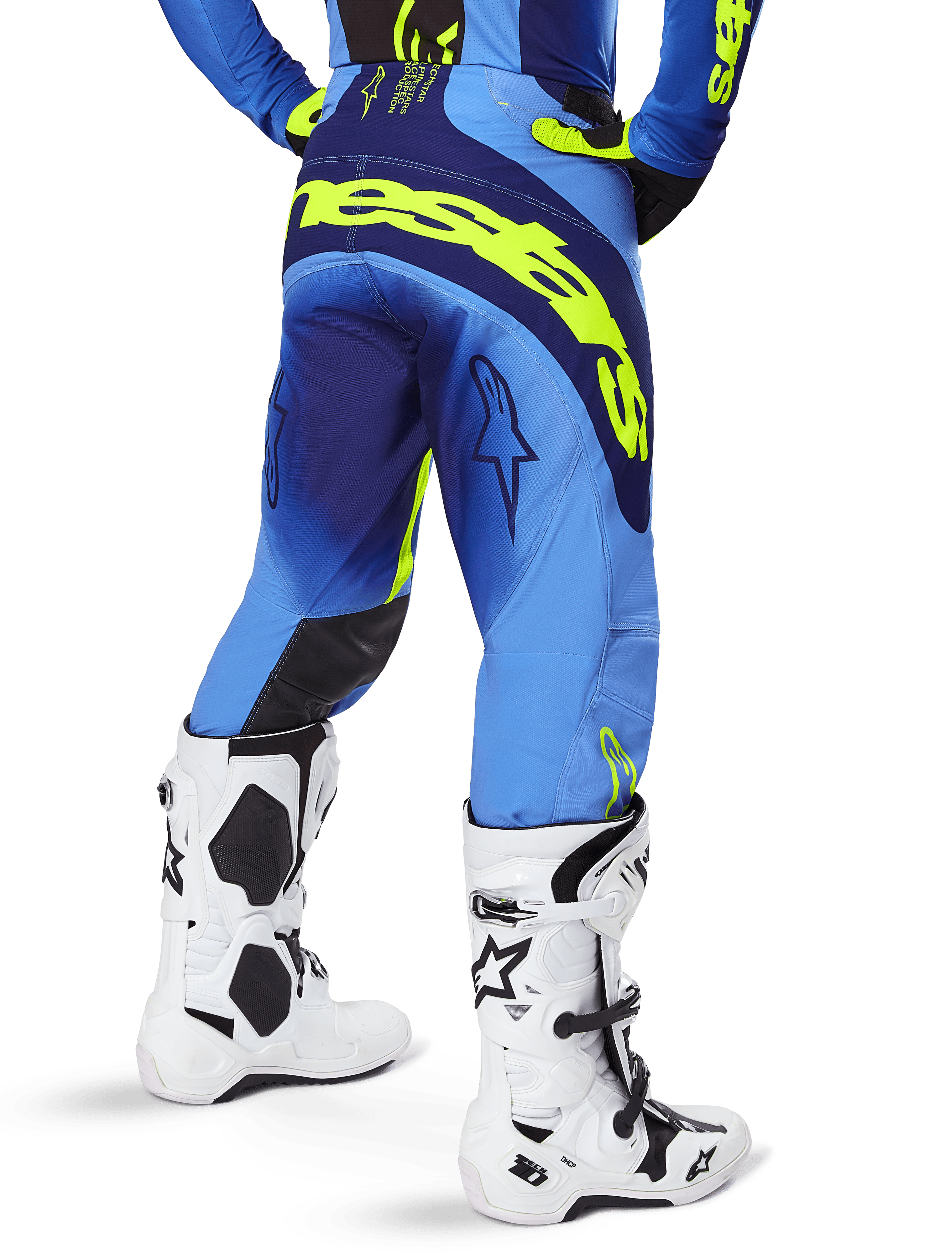 Alpinestars 2025 Techstar Melt Pants, Motocross Pants, Blue and Yellow Fluo, back view showing large yellow branding on the seat and thighs, worn with white motocross boots and matching blue jersey, athletic race fit for off-road riding