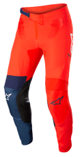 Alpinestars Supertech Blaze Pants, Motocross Off-Road Pants, Bright Red and Dark Blue with White accents, featuring black leather inner knee patches, adjustable ratchet waist closure, white and blue Alpinestars logos, durable stretch construction for motocross racing