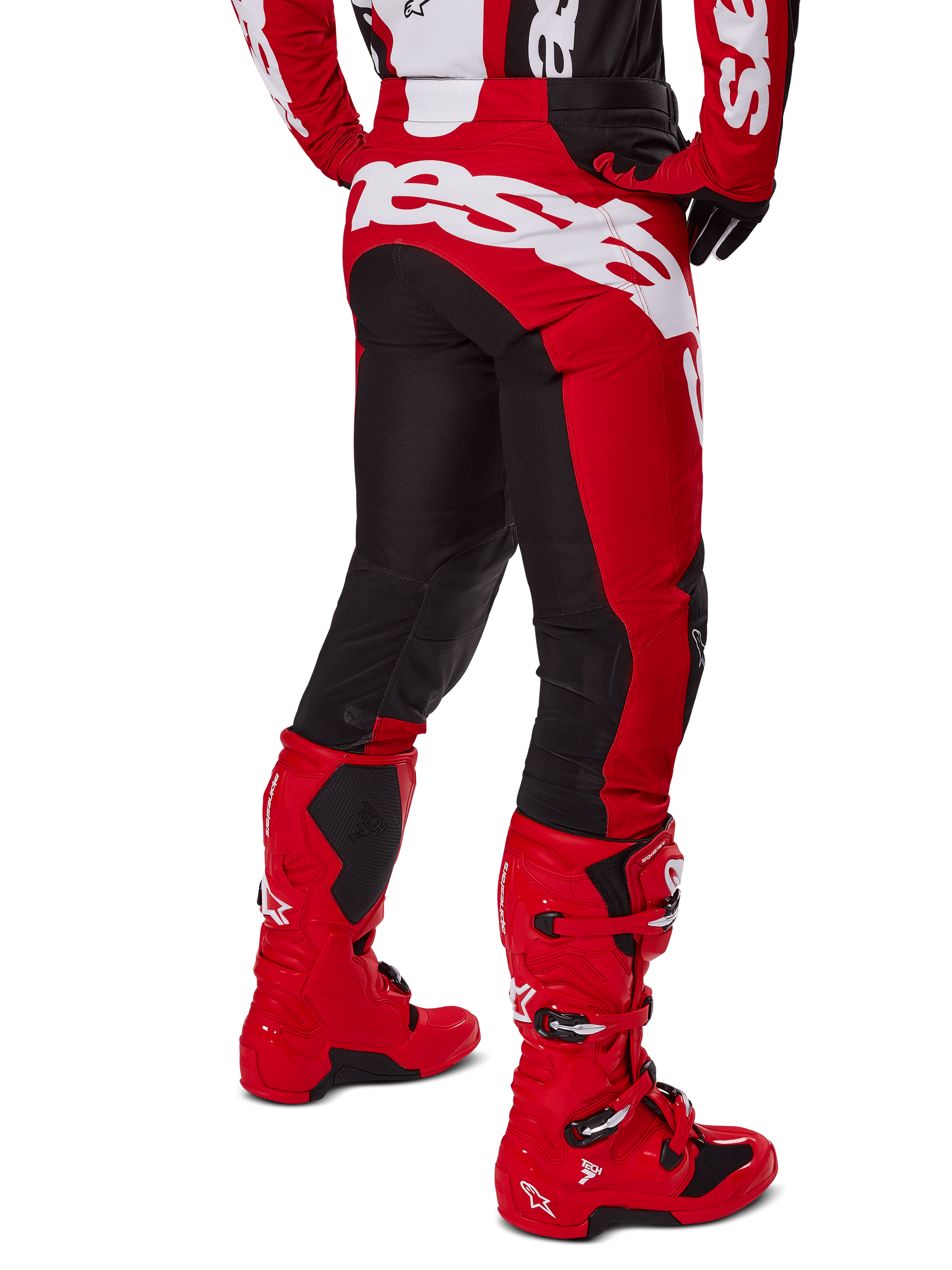 Alpinestars 2025 Racer Veil Pants, Motocross Pants, Black and Bright Red, rear view featuring large white Alpinestars branding across the seat, black stretch panels on back legs, worn with matching red racing boots, durable off-road racing gear