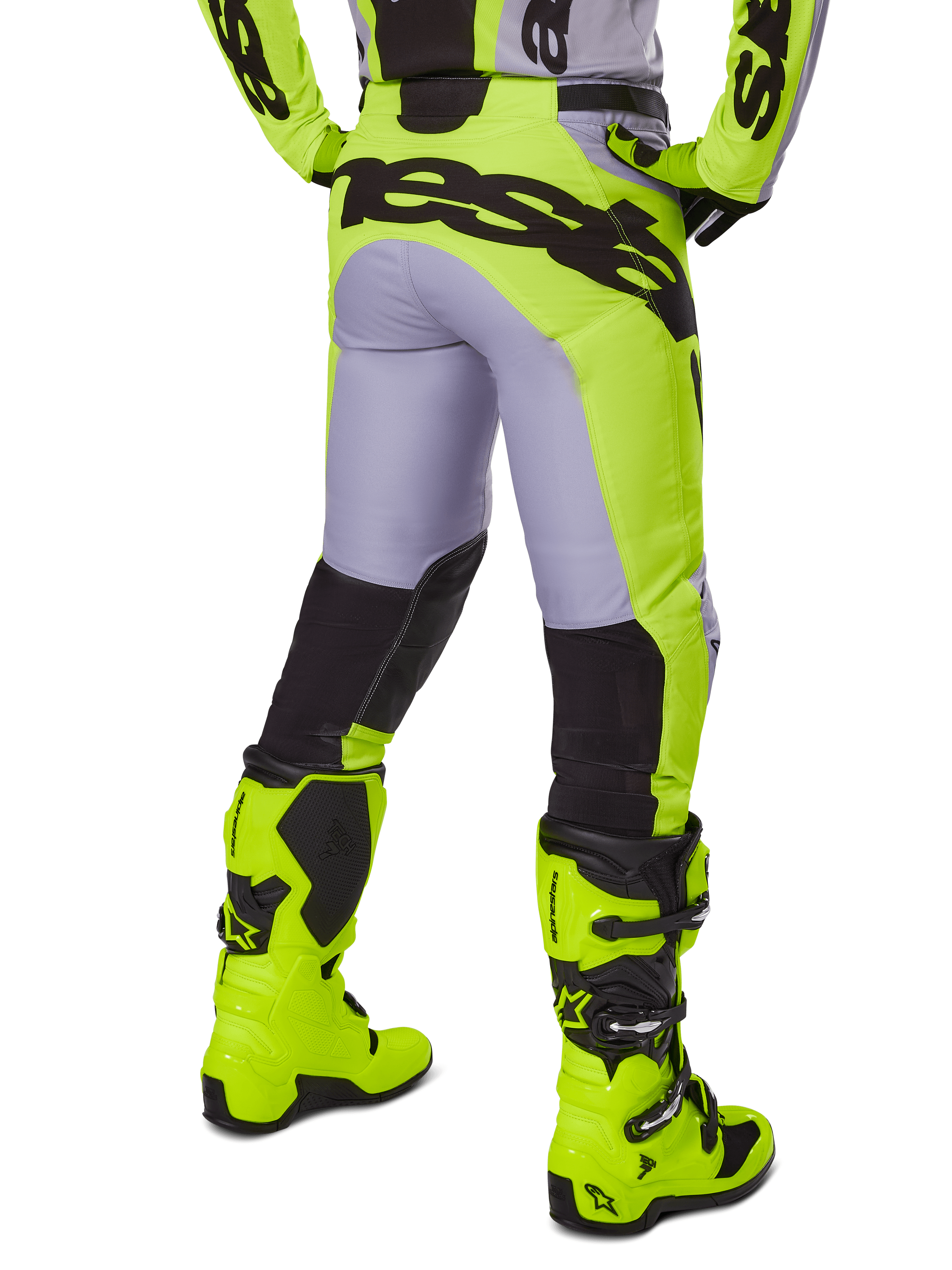 Alpinestars 2025 Racer Veil Pants, Motocross Pants, Gray and Yellow Fluo, rear view showing ergonomic construction with large black branding across the seat, black lower leg panels, and matching bright yellow racing boots.