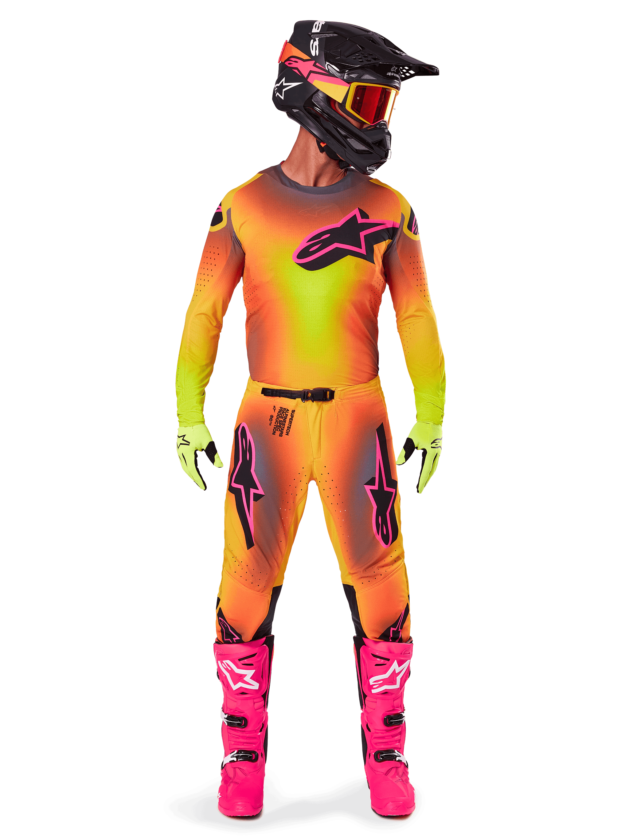 Motocross rider wearing the Alpinestars 2025 Supertech Lipan gear, featuring a vibrant Yellow and Pink gradient design, matching long-sleeved jersey, bright pink boots, lime green gloves, and a black helmet with orange goggles.