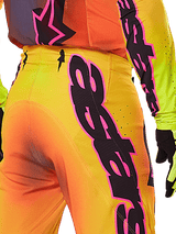 Alpinestars 2025 Supertech Lipan Pants, Motocross Pants, Yellow and Pink, close-up of back and side featuring bold black and pink Alpinestars graphics, worn with matching racing gear