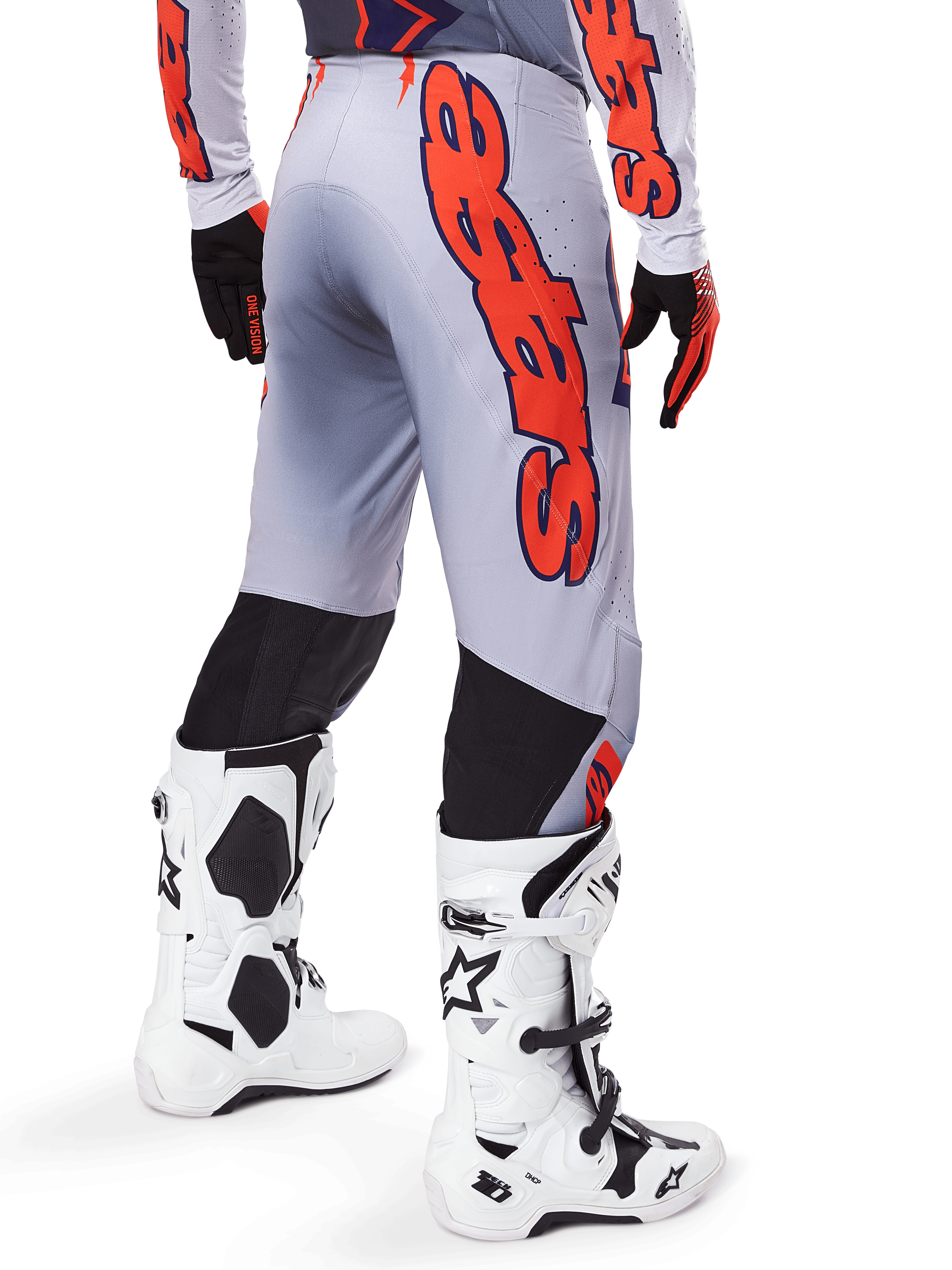 Alpinestars 2025 Supertech Lipan Pants, Motocross Pants, Gray and Orange Fluo, worn with matching jersey and white boots, back view featuring large orange Alpinestars graphic branding, black stretch panels, professional dirt bike racing gear