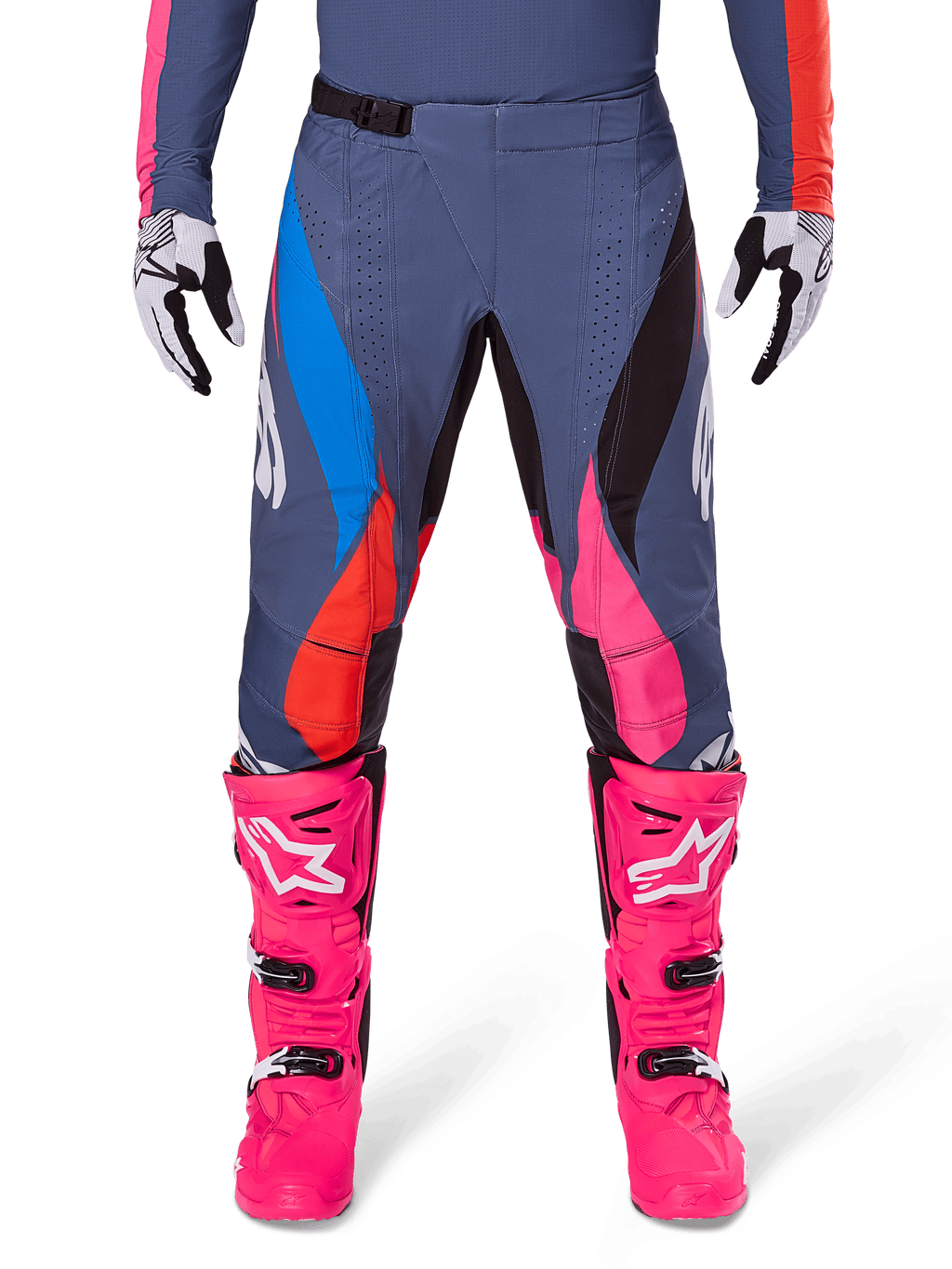 Alpinestars 2025 Techstar Dreem Pants, Motocross Pants, Gray Multicolor with blue, pink, and orange accents, worn with bright pink boots and white and black gloves, featuring laser-cut perforations on the thighs and a magnetic waist buckle, athletic race-fit gear for off-road competition
