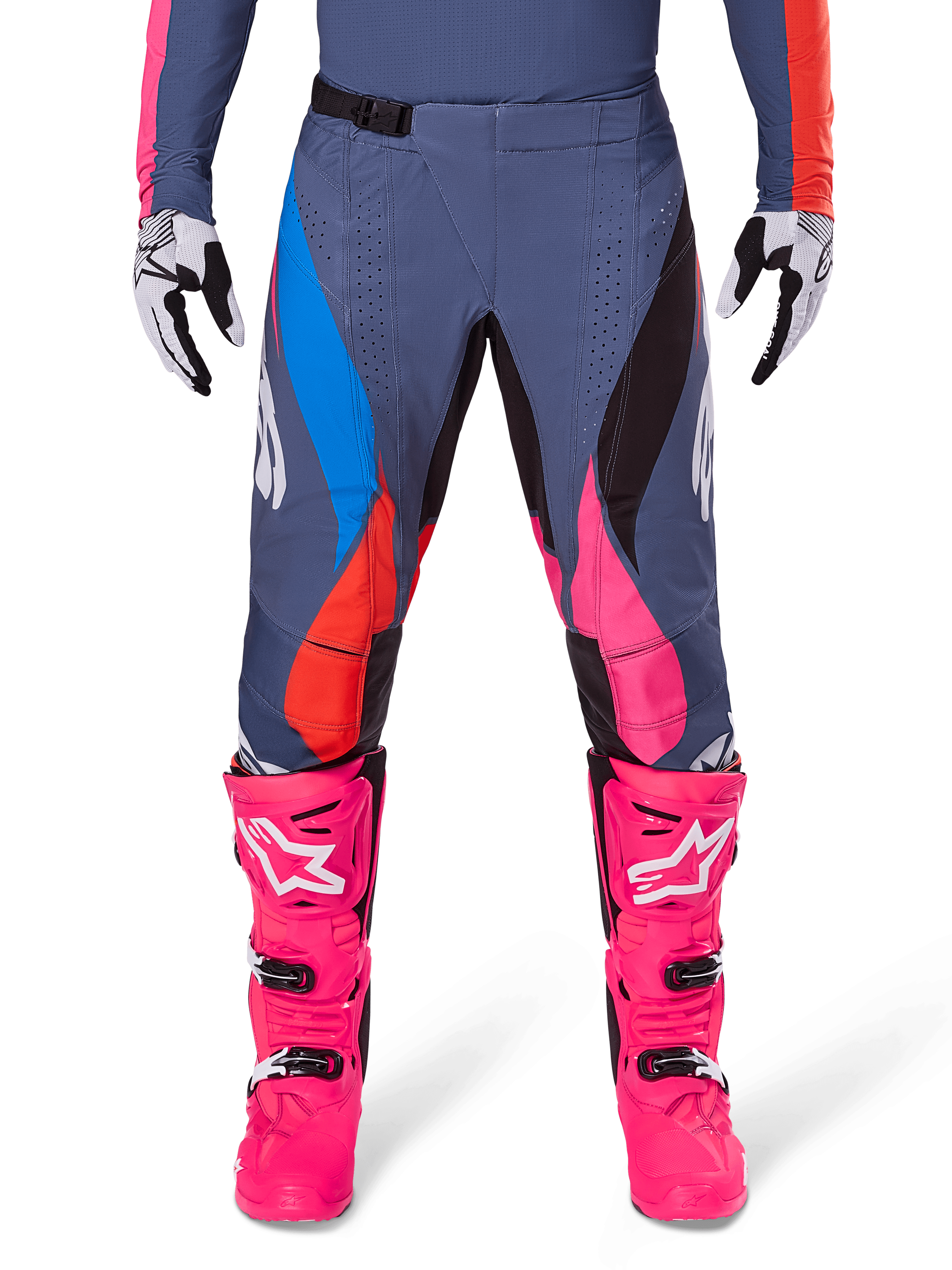 Alpinestars 2025 Techstar Dreem Pants, Motocross Pants, Gray Multicolor with blue, pink, and orange accents, worn with bright pink boots and white and black gloves, featuring laser-cut perforations on the thighs and a magnetic waist buckle, athletic race-fit gear for off-road competition
