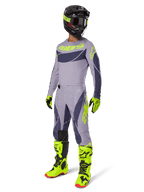 Alpinestars 2025 Techstar Dreem Pants, Motocross Pants, Gray and Dark Gray with neon green accents, worn with matching jersey, bright neon green boots, and black helmet, full professional motocross gear set
