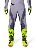 Alpinestars 2025 Techstar Dreem Pants, Motocross Pants, Light Gray and Dark Gray with neon yellow accents, paired with neon yellow boots and gloves, laser-cut ventilation, black buckles, red boot soles, professional motocross gear