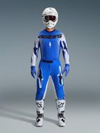 Alpinestars 2026 Supertech Scenz Gear Set, Motocross Racing Gear, Ucla Blue and White, complete racing outfit featuring a blue jersey with black 'astars' logo, matching pants with star graphics, white helmet with dark goggles, blue gloves, and white boots with black accents