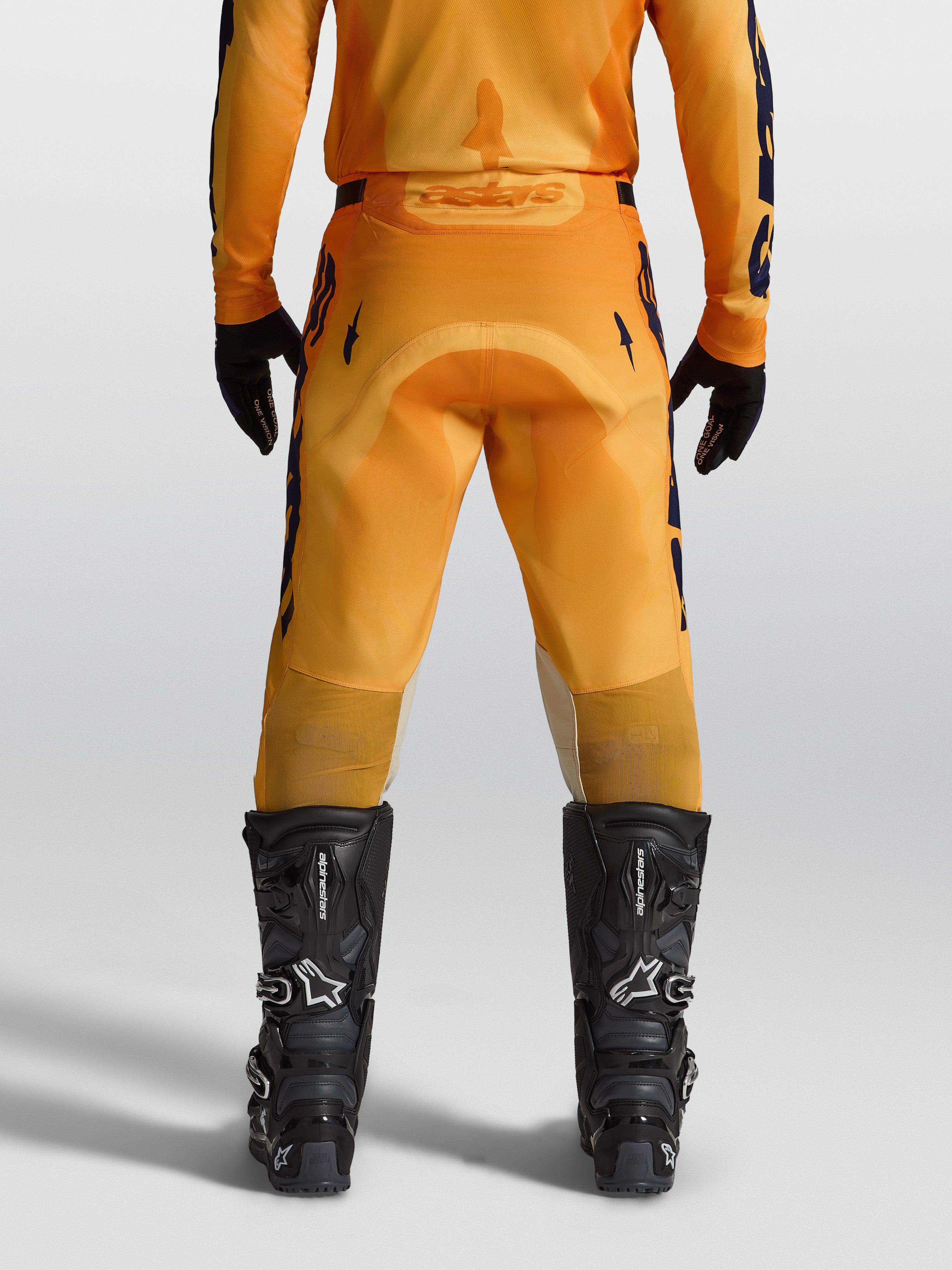 Alpinestars Racer Amber Pants, Men's Motocross Pants in Orange and Deep Blue, featuring a durable reinforced seat.