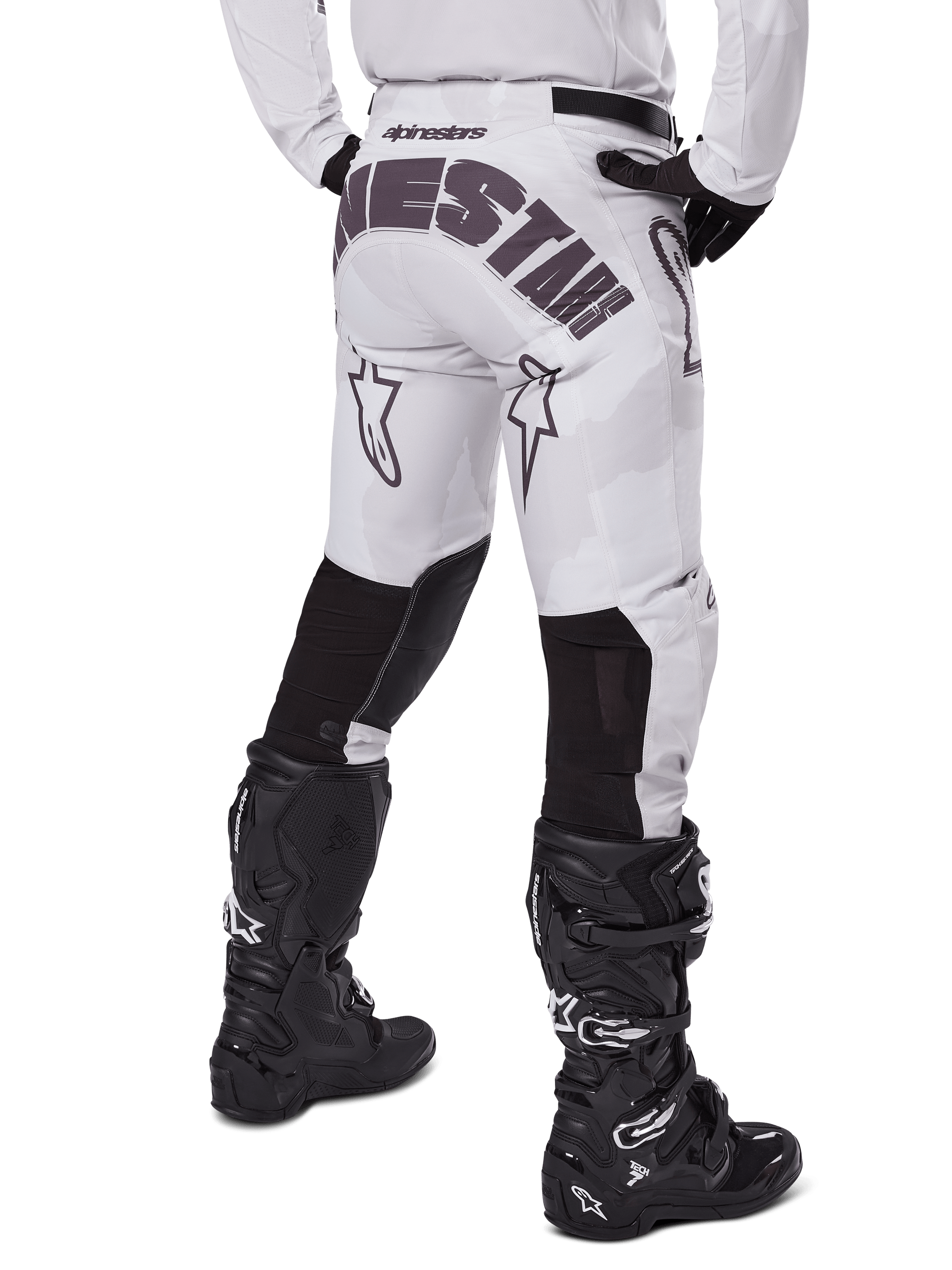 Alpinestars 2025 Racer Hollow Pants, Motocross Pants, Light Camo Brown, rear view of rider showing large branding on seat and black stretch panels on lower legs, paired with black Tech 7 boots
