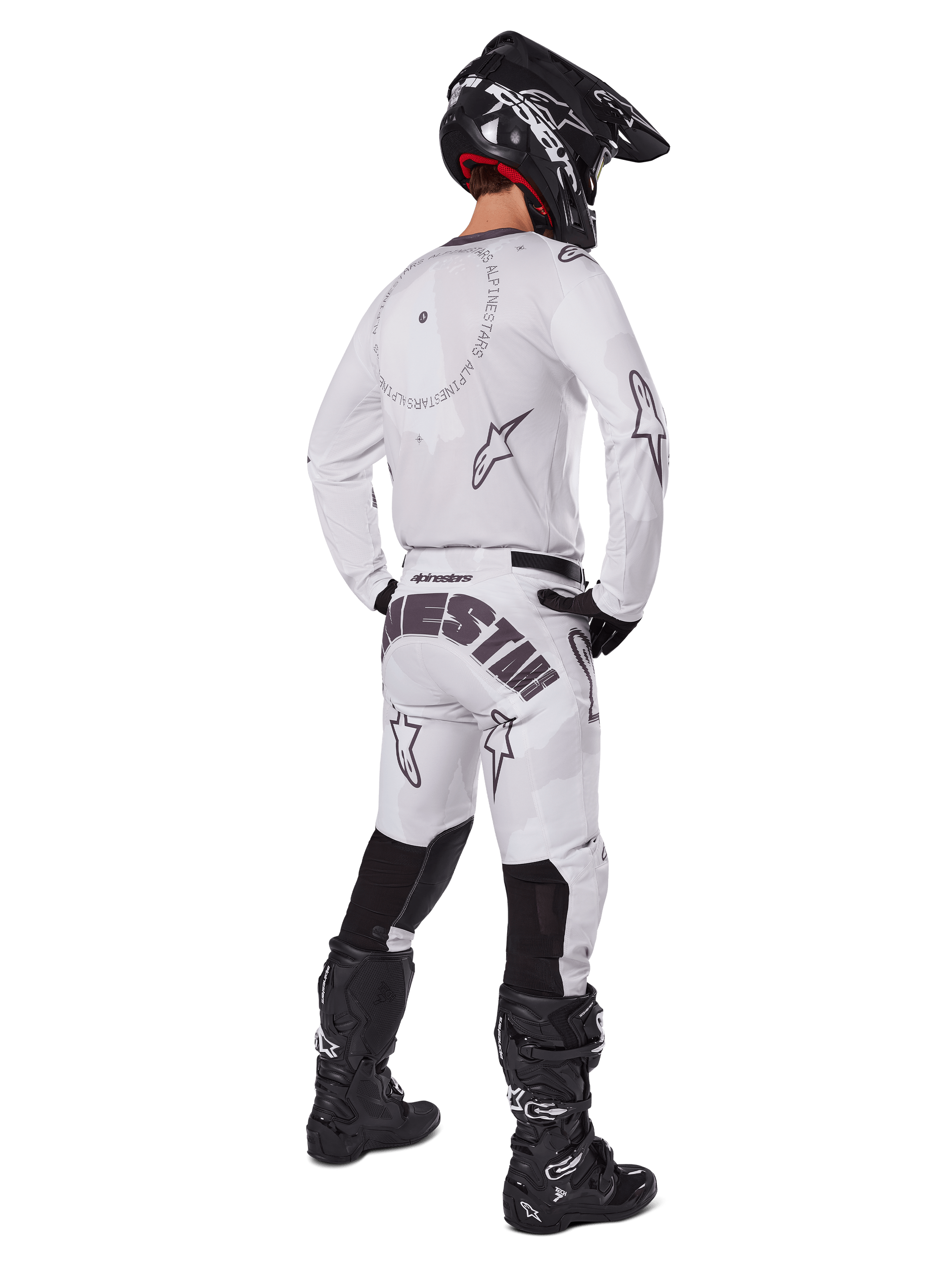 Alpinestars 2025 Racer Hollow Pants, Motocross Pants, Light Camo Brown and White, rear view showing bold black branding on the seat and star logos, worn with matching jersey, black boots, and black helmet for a complete off-road racing look