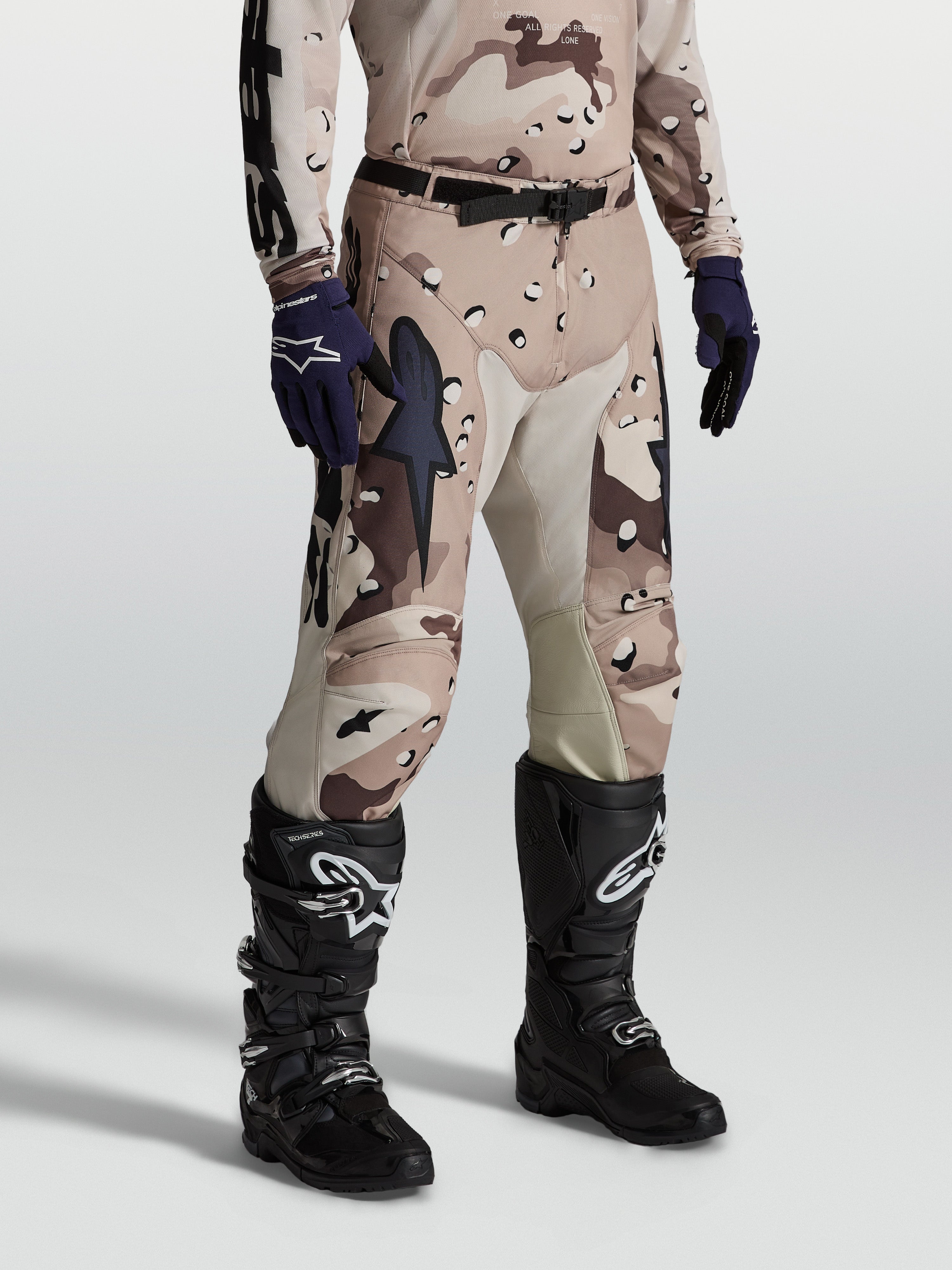 Alpinestars Racer Lone Pants, men's motocross gear in Desert Camo, featuring 600D polyfabric and leather inner knee panels.