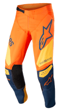 Alpinestars Techstar Factory Pants, Motocross Pants, Orange and Dark Blue with Warm Yellow, featuring bold branding, 3D Babel knee construction with black leather inner patches, and an adjustable waist ratchet system for off-road racing.