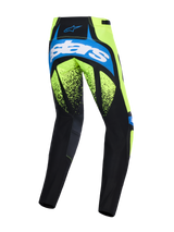 Alpinestars 2026 Techstar Nomur Pants, Motocross Pants, Dark Navy, Yellow Fluo, and UCLA Blue, rear view featuring large 'astars' branding on the seat, fluorescent yellow panels with black speckled graphics, and durable dark panels for off-road racing performance.