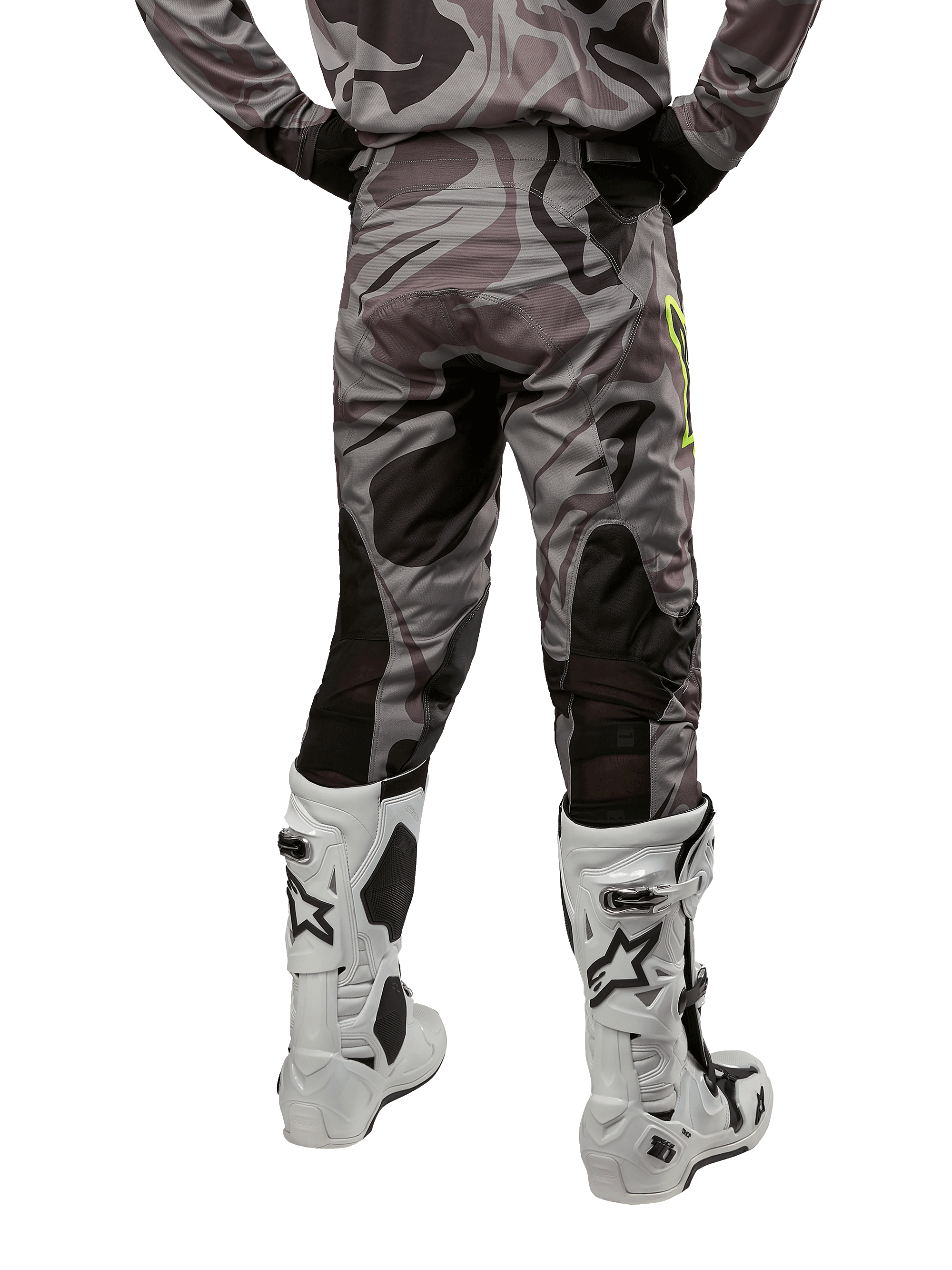 Alpinestars 2024 Racer Tactical Pants, Motocross Pants, Cast Gray Camo Magnet, rear view showing camouflage pattern and black breathable stretch zones, worn with white and black motocross boots, designed for off-road racing.