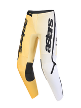 Alpinestars 2026 Fluid Apex Pants, Motocross Pants, Yellow White and Black, featuring a gradient color scheme, bold vertical astars branding on the thighs, black reinforced knee panels, and an ergonomic pre-curved design for off-road performance.
