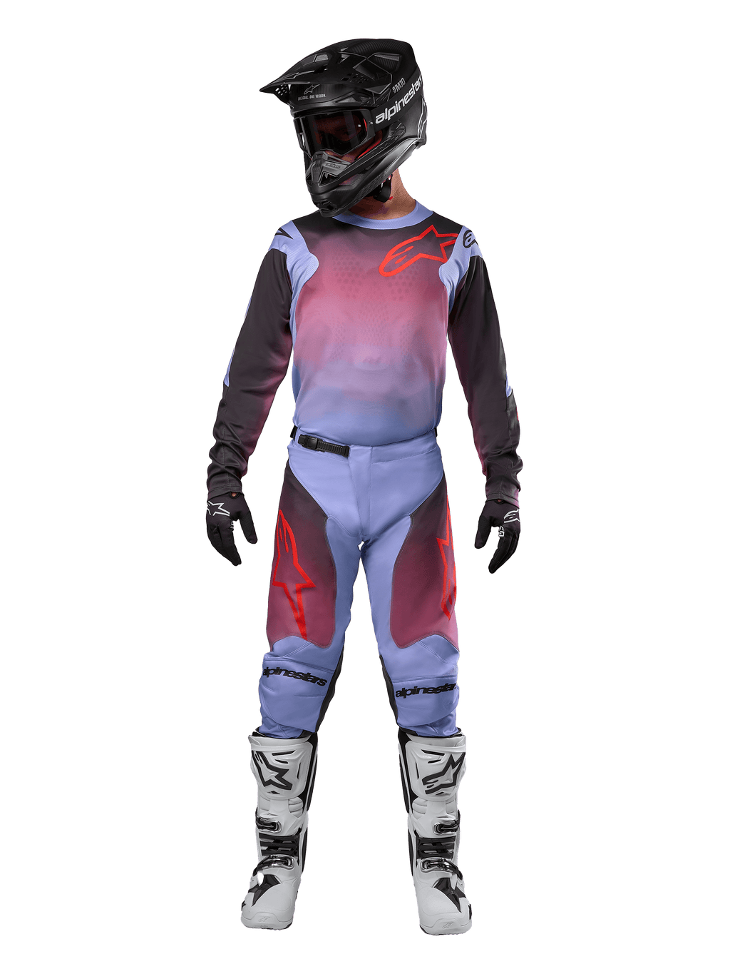 Motocross rider wearing complete racing gear, Alpinestars 2024 Racer Hoen Jersey and Pants, Lavan Purple and Black with red accents, black helmet, white and black boots, black gloves, coordinated outfit for off-road racing