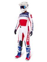 Alpinestars Limited Edition Techstar Fortitude Pants, Motocross gear set, Red White and Blue, worn with matching jersey, white helmet, blue goggles, and blue and red boots, coordinated professional racing outfit for off-road competition