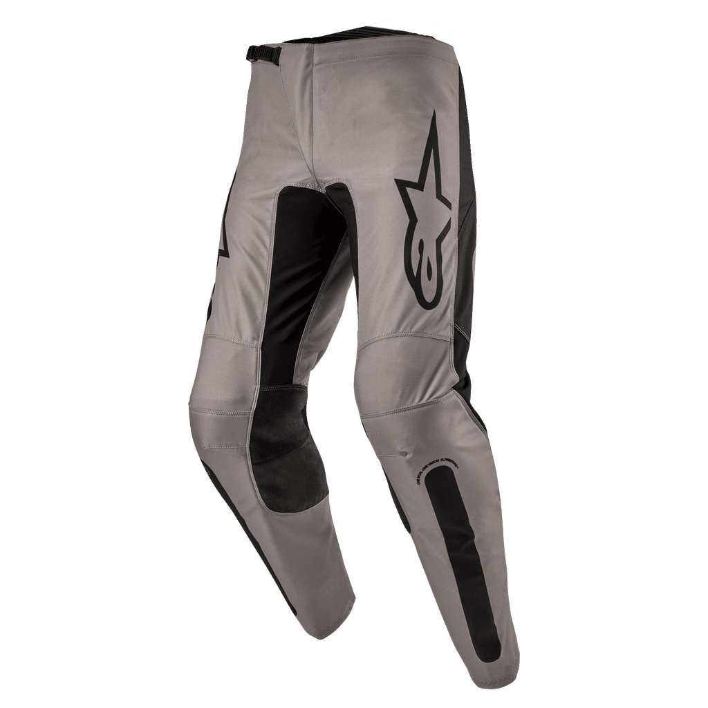 Alpinestars 2024 Fluid Lurv Pants, Motocross Pants, Mud Black, featuring a greyish-tan main chassis with black stretch panels on the inner legs and knees, prominent black Alpinestars logo on the thigh, ergonomic pre-curved design for off-road riding