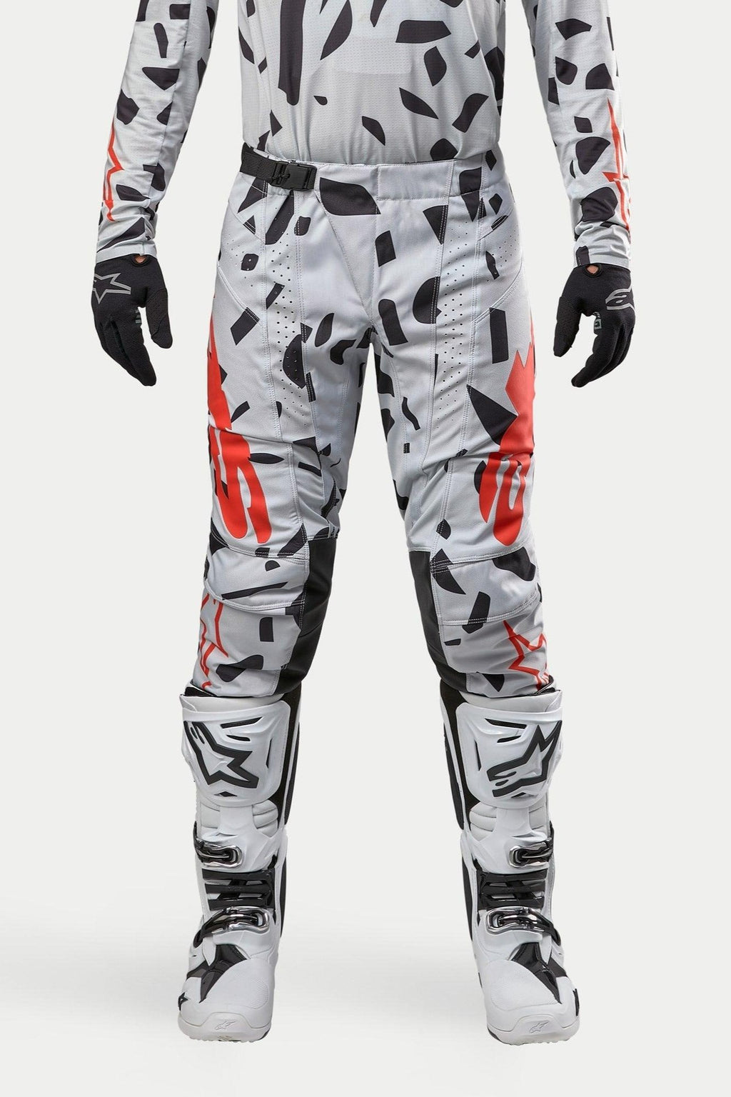 Alpinestars 2024 Techstar Rantera Pants, Motocross Pants, Haze Gray Camo, worn with matching jersey, black gloves and white boots, featuring black spot pattern and red Alpinestars branding, durable design for off-road racing