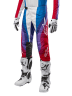 Alpinestars 2024 Techstar Pneuma Pants, Motocross Racing Pants, Blu Mars Red White, worn with matching jersey, white racing boots and gloves, vibrant graphic design with red blue and purple accents, perforated for breathability
