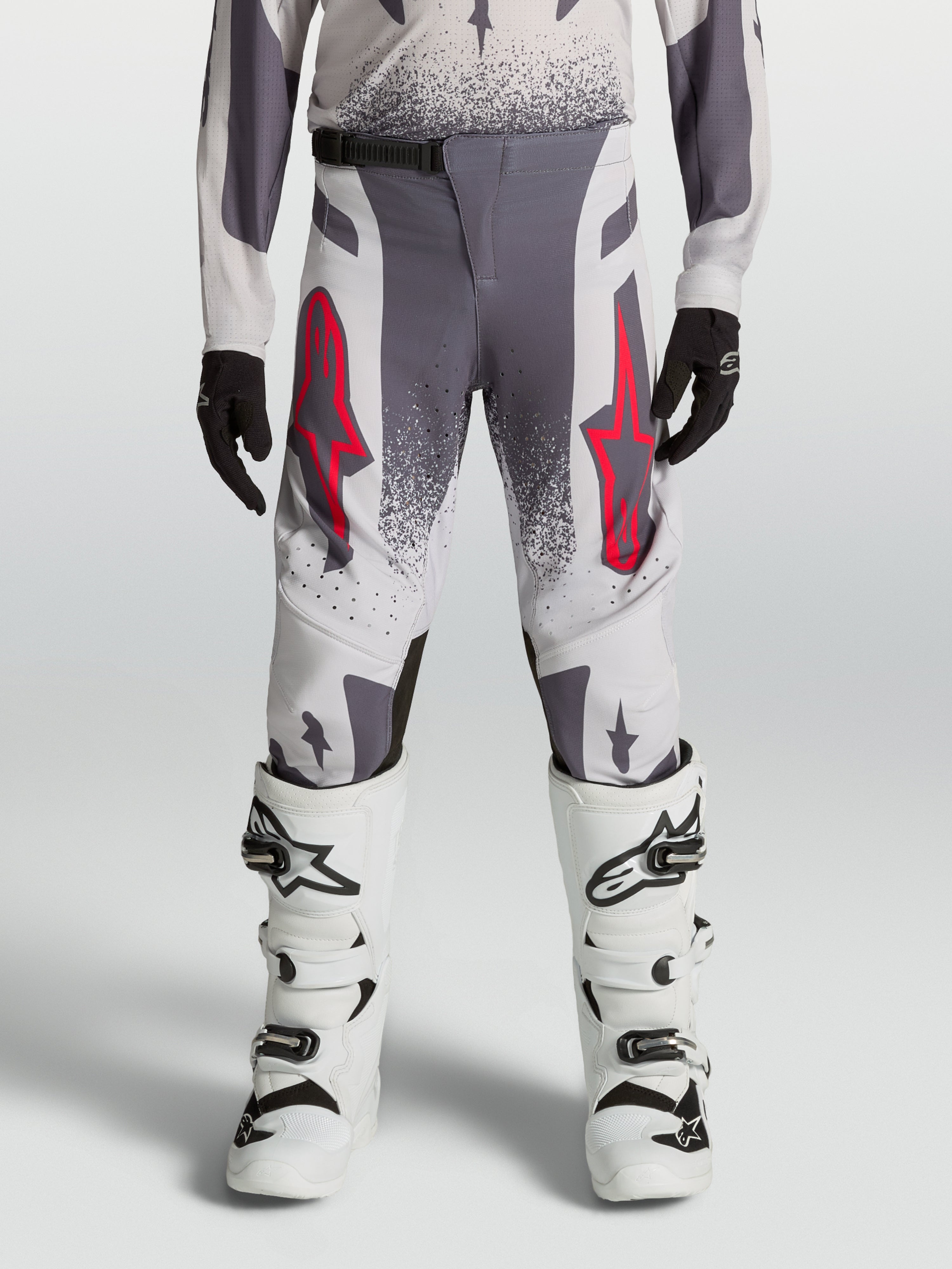 Alpinestars Youth Supertech Swan Pants, performance motocross racing gear in gray and lilac textile with red accents.