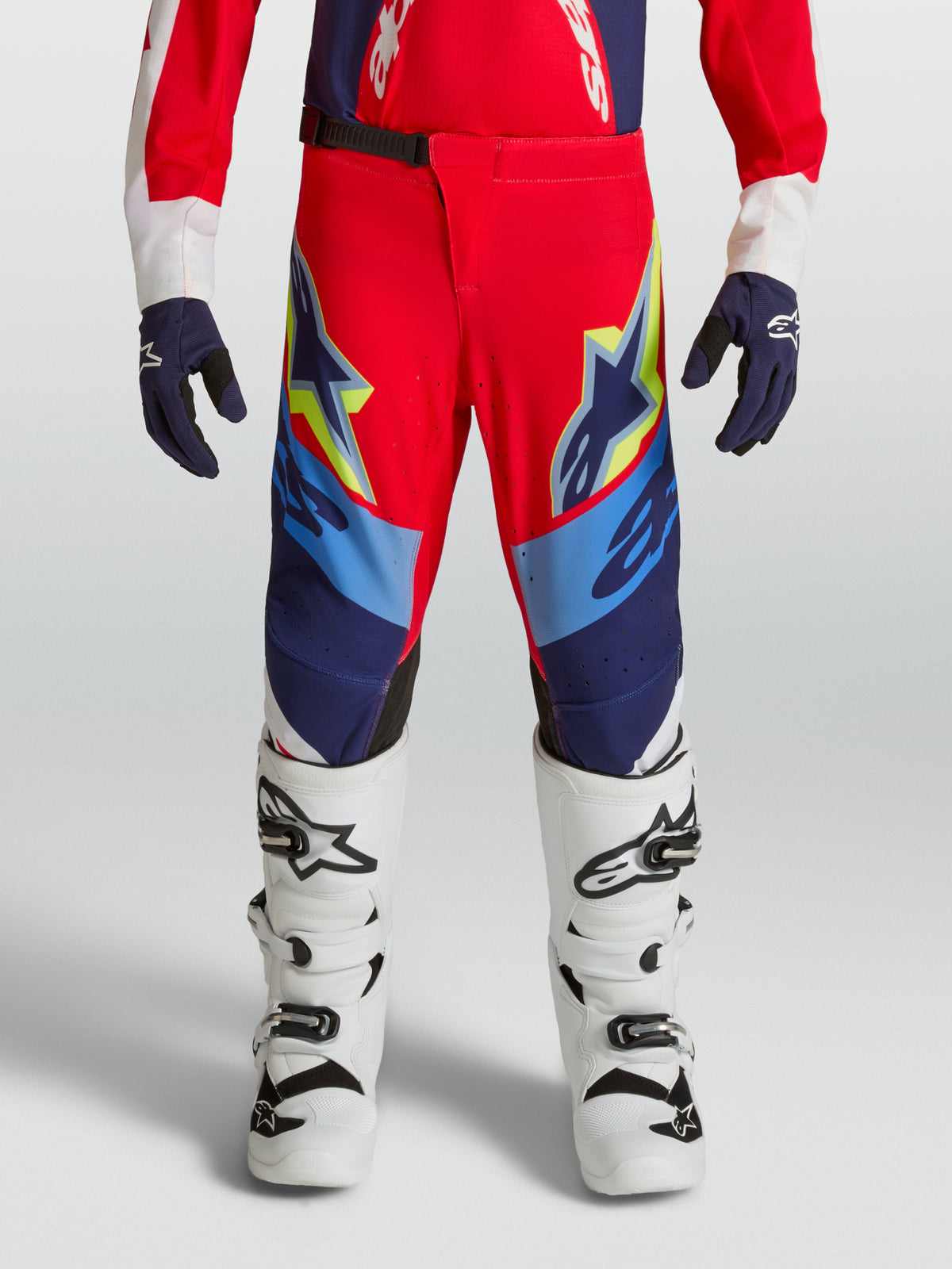 Alpinestars Youth Supertech Dyna Pants, Fire Red and Navy Blue motocross racing pants with a premium athletic stretch fit.